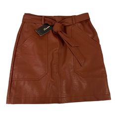 Brown Leather Skirt Chic Brown Skirt With Pockets, Trendy Brown Mini Skirt For Work, Chic Brown Belted Skirt, High-waist Brown Mini Skirt, Brown Mini Skirt With Belt Loops, Brown Belted Mini Skirt, Trendy Brown Workwear Skirt, Casual Brown Belted Skirt, Spring Brown Skirt With Belt Loops