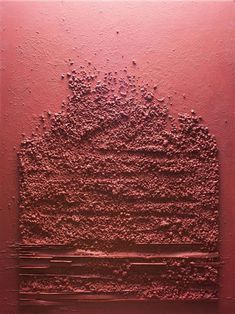 an abstract painting with red paint on the wall