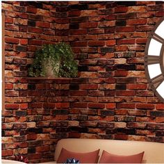 a bedroom with brick walls and a round mirror on the wall above it, along with a bed