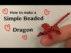 a hand holding a beaded dragon on top of a piece of paper with the words how to make a simple bead dragon