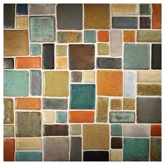 a tile wall with many different colors and shapes