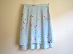 "Sky Blue Skirt Floral Print Skirt A Line Knee Skirt Floral Print Skirt Summer Skirt Light Blue Skirt Medium Size Label size: EUR 36/38 Measurements: (taken laying flat): Waist: 15\" / 38cm Hips: 20\" / 51cm Length: 25\" / 63.5cm Condition: great Vintage Condition Please check measurements to insure a proper fit. Remember to allow yourself some extra room for movement. You can compare these with something from your closet that fits you well. SHIPPING * I ship worldwide via Priority mail. * I shi Blue Flowy Long Wrap Skirt, Flowy Blue Long Wrap Skirt, Blue Flared Flowy Wrap Skirt, Blue Flowy Flared Wrap Skirt, Light Blue Midi Skirt For Summer, Light Blue Long Skirt For Summer, Light Blue Tiered Skirt With Lining, Blue Flared Wrap Skirt, Blue Flowy Lined Wrap Skirt