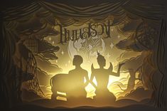 two paper cut figures sitting in front of a curtain with the word sunset on it