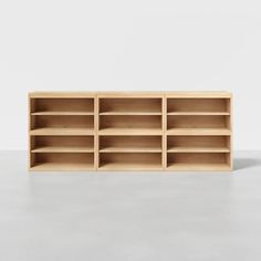 an empty wooden shelf with several shelves on each side and no one in the room