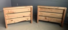 two wooden nightstands sitting next to each other