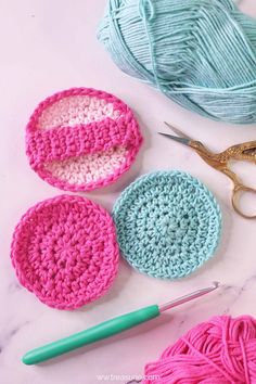 crochet supplies including yarn and scissors on a table