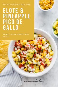 a white bowl filled with pineapple salsa next to tortilla chips and guacamole