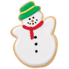 a cookie decorated like a snowman with a green hat and scarf on it's head