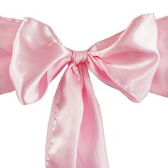 a pink bow tied to the side of a white wall with clippings on it