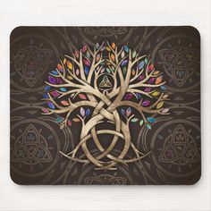 a tree with colorful leaves is shown on a brown background, surrounded by celtic symbols