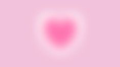 a pink heart shaped object on a light pink background