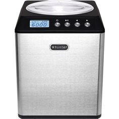 a silver and black portable ice maker with digital clock on the front panel, showing time