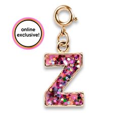 the letter z is made up of multicolored sequins and sits on a gold plated charm