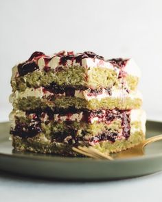 two pieces of cake on a plate with a fork