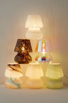 several different colored lamps sitting next to each other