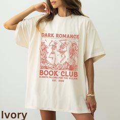 a woman wearing a t - shirt that reads dark romance book club