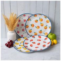 Dimensions: 0.63" H x 10.5" W x 10.5" D Material: Melamine Color: White, Blue, Red & Orange Care & Safety: Food Safe; Dishwasher Safe Top Rack Only; Do Not Microwave Quantity: 4 Create a charming table spread by setting out Scattered Fruits Scalloped Plates! These matte melamine plates boast a slightly scalloped construction, perfect for adding subtle texture to your table. Each one also features a cute design of scattered strawberries, cherries, peaches, or pineapples for extra visual appeal. Set these lovely plates out with matching dinnerware to put together a unique dinner display! Dinner Display, Scalloped Plates, Table Spread, Unique Dinner, Melamine Plates, Subtle Textures, Food Safe, Cute Designs, Put Together