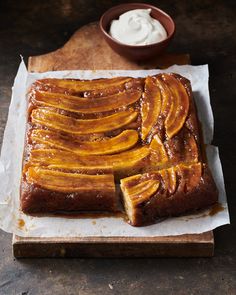 sliced bananas sitting on top of a wooden cutting board