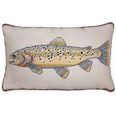 a decorative pillow with a fish on it