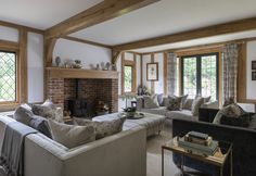 a living room filled with furniture and a fire place