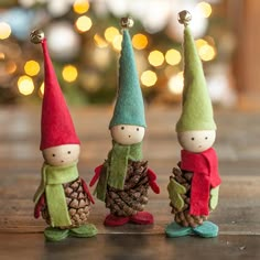 three little gnomes are standing next to each other