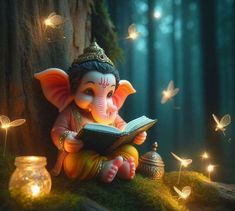 an elephant statue sitting in the grass reading a book