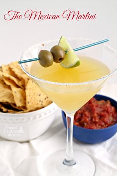 the mexican martini is garnished with olives