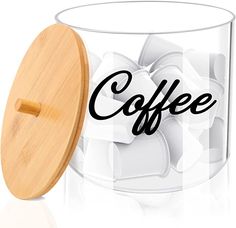 a wooden lid on a glass container with ice cubes in the bottom and word coffee printed on it