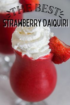 strawberry daiquite with whipped cream and strawberries in the background text reads, the best strawberry daiquite