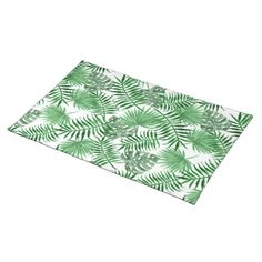 a place mat with green leaves on it