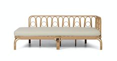 a wooden bench with a white cushion on it's back end and side panels