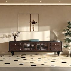 a living room with a table and potted plants