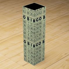 a tall cardboard box sitting on top of a wooden floor