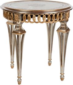 an ornately decorated table with gold trimmings and metal accents on the legs