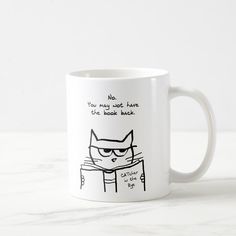 a white coffee mug with an image of a cat reading the text light reading for cats