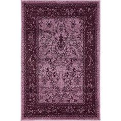 a purple area rug with an intricate design on the center and bottom, in front of a white background