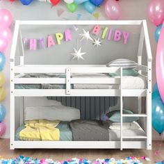 there is a bunk bed with balloons and streamers