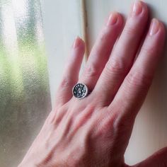 I made this ring with sterling silver precious metal clay casting it from a mold I made of an antique button depicting a gracefully curving carnation flower in profile. I attached sterling silver wire for the band while the clay was in it's dried but unfired state. Once fired in my kiln the clay becomes pure sterling silver and it magically (it seems to me) bonds itself with the wire. The rustic image is enhanced by the painstaking layering of techniques: burnishing, oxidizing, buffing away surf Metal Clay Rings, Clay Casting, January Birth Flower, January Birth Flowers, Silver Clay, Victorian Flowers, Carnation Flower, Precious Metal Clay, Antique Buttons