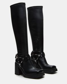 The ONYX is a sleek moto-inspired boot, featuring a bold block heel and reaching to the knee. Elevate your style with these statement boots that provide both fashion and function—expertly crafted for comfort and durability. 3.25 inch heel height 13.5 inch shaft circumference 16.25 inch shaft height Vegan leather upper Black Leather Moto Boots, Black Buckle Boots, Statement Boots, Black Knees, Charli Xcx, Buckle Boots, Black Boots Women, Gorgeous Shoes, 90s Style