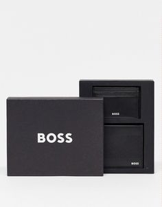 a black box with the word boss on it and an empty wallet in front of it