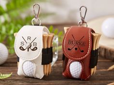 two key chains with golf balls on them