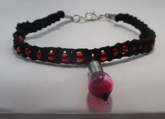 Some say that blood is one of the most powerful ingredients for magic.  Whether its the blood of those who are against you or your own blood, one thing is certain blood is the very essence of a living being. This simple bracelet is made with black hemp and red, translucent beads. From the center, hangs a blood drop charm. Perfect to accent a witch or vampire costume.  If you need the bracelet larger or smaller, send a note when you order. I will resize it free of charge.  I look forward to doing business with you. Hemp Macrame, Blood Drop, Halloween Bracelet, Vampire Costume, Bracelet Simple, Simple Bracelets, A Witch, Braided Bracelets, Most Powerful