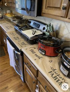 a kitchen counter with pots and pans on it