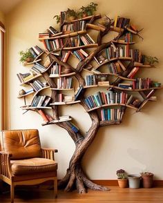 a tree shaped bookshelf in the corner of a room with a leather chair