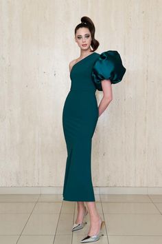 The Greta Constantine Amaryllis Dress features a striking asymmetrical neckline with an exaggerated flourish sleeve, creating a bold yet elegant look. This A-line gown balances a sleek silhouette with a dramatic statement sleeve, making it a standout choice for formal events and galas. True to size 68% polyamide | 32% elastane body Made in Toronto | Fabric milled in Italy Dry Clean *Note that Special Order pieces take 22 - 26 weeks to ship. Greta Constantine, Statement Sleeves, Asymmetrical Neckline, Timor Leste, A Line Gown, Caicos Islands, Vanuatu, Turks And Caicos Islands, Guinea Bissau