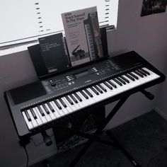 an electronic keyboard sitting on top of a table