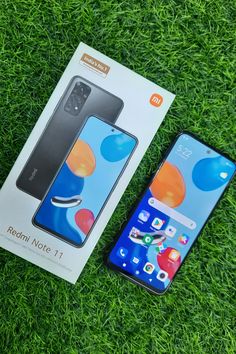 the new redmi note 11 is in its box and next to it's packaging