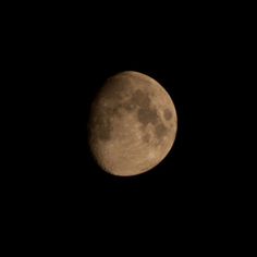 the full moon is seen in the dark sky with no clouds on it's side