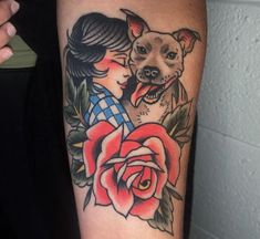 a woman with a dog tattoo on her arm