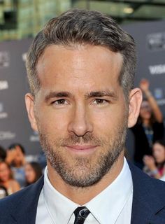 Comb Over - This simple yet stylish combed-back hairstyle is great for adding weight to grey hair. In this shot, Ryan Reynolds is sporting a smooth, combed-back style. Notice how the hair gets combed to the side as the style goes further back on the head. Combined with clipped sides, this hairstyle makes a confident statement that pairs well with peppered hair. The tiny quiff/pompadour at the front helps to add weight and texture, which hairstylist Jamie Stevens says is a crucial aspect of an ol Combover Hairstyles, Hairstyles For Receding Hairline, Haircut For Men, Trendy Mens Haircuts, Mens Hairstyles Medium